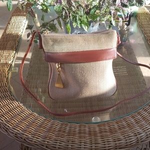 Tan basketweave crossbody with rust leather trim